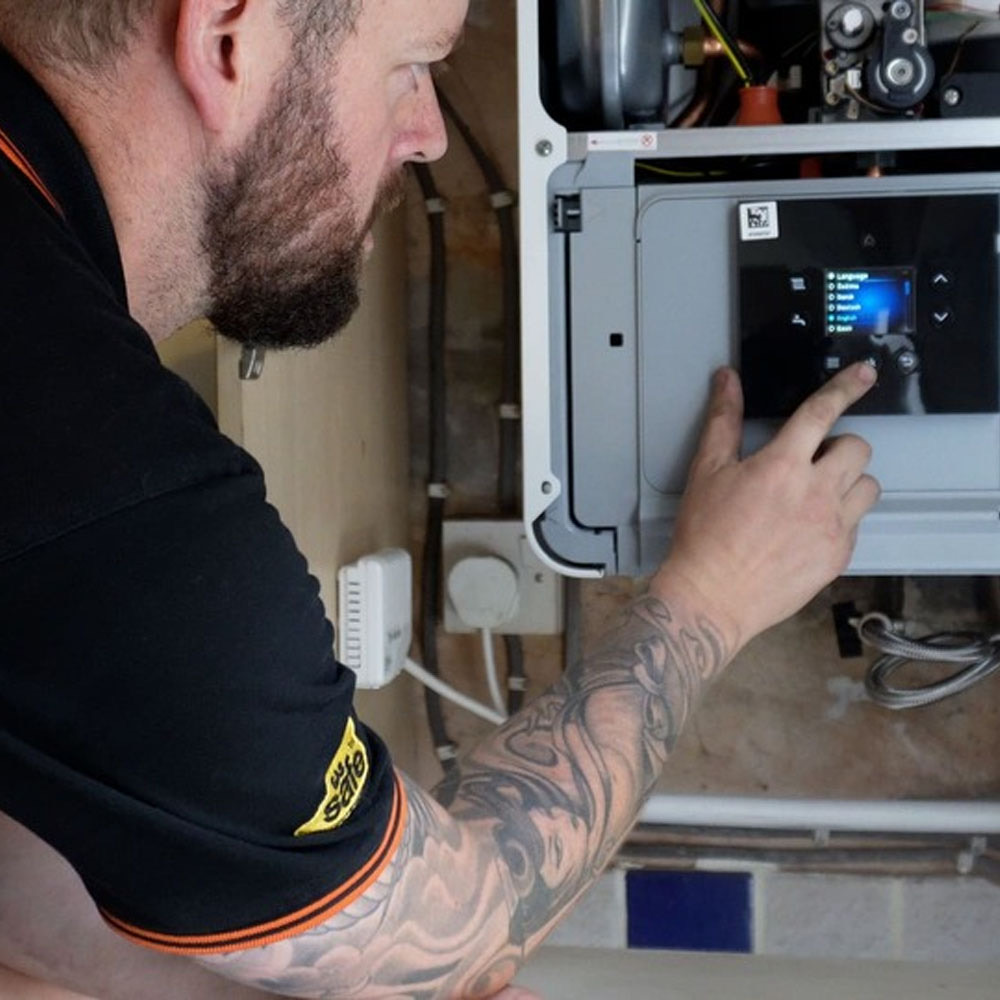RJ Martindale engineer servicing a boiler
