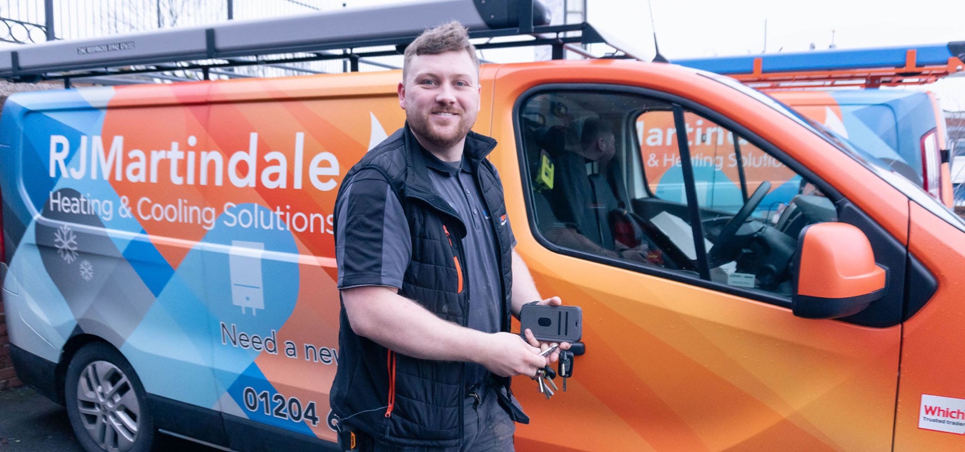Gas Safe engineer Dan in front of an RJ Martindale van