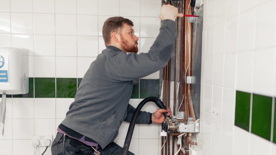 Engineer installing a new boiler